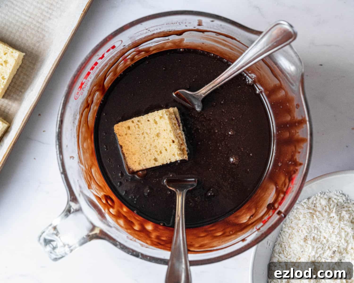 Step 6, dunking the squares in chocolate.