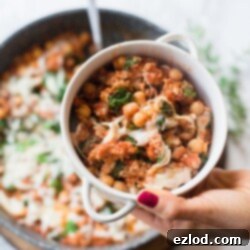 A delicious and healthy one-pan sausage, bean, and kale skillet, ready to serve.