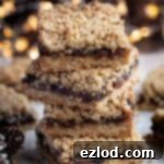 Vegan Mincemeat Crumb Bars 10 A stack of golden-brown vegan mincemeat crumble bars.