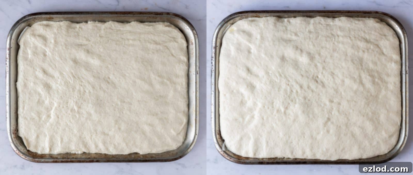 Focaccia dough in a baking tin, after its second rise, looking puffy and ready for dimpling and toppings.