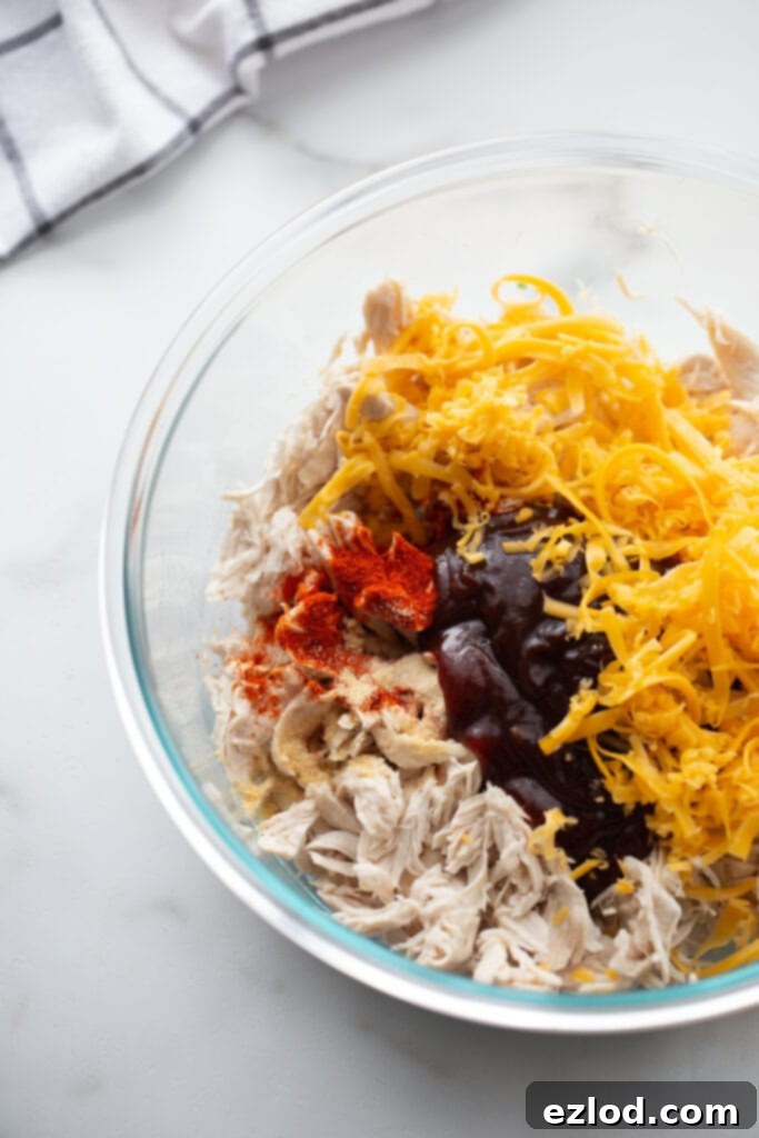 Glass bowl of filling for BBQ Chicken zucchini boats