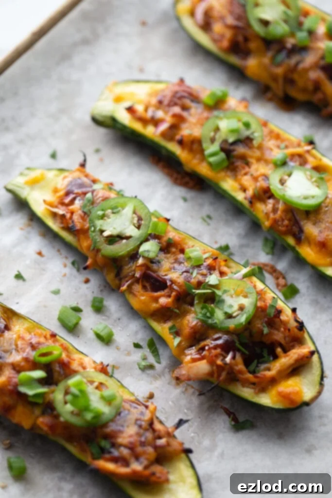 Finished BBQ Chicken Stuffed Zucchini Boats on a sheet pan