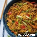 Close up of a bowl of curry noodles.
