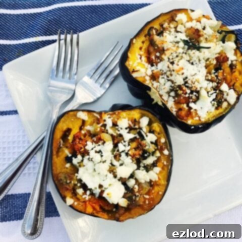 Stuffed Acorn Squash halves filled with sausage, spinach, and feta cheese.
