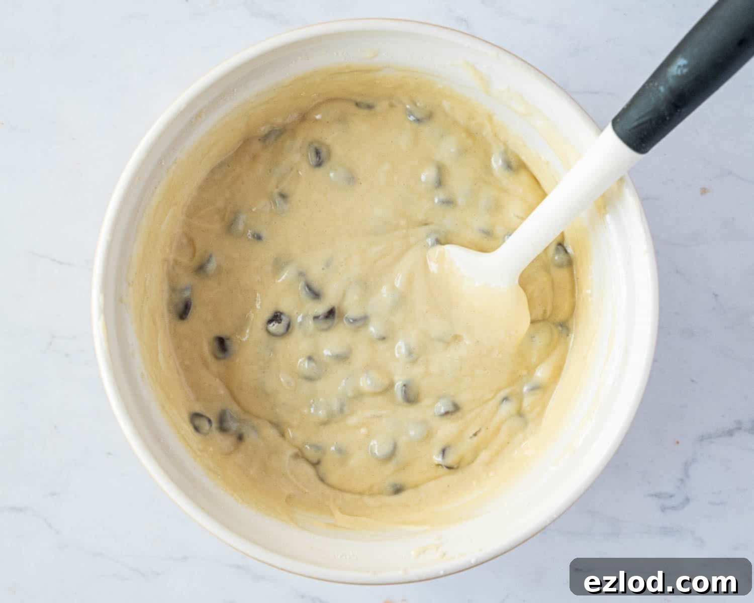 Step 4: The perfectly mixed vegan chocolate chip vanilla cake batter, with chocolate chips gently folded in.