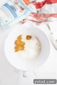 Dry ingredients for muffins in a white bowl with Bob's Red Mill flour bag.