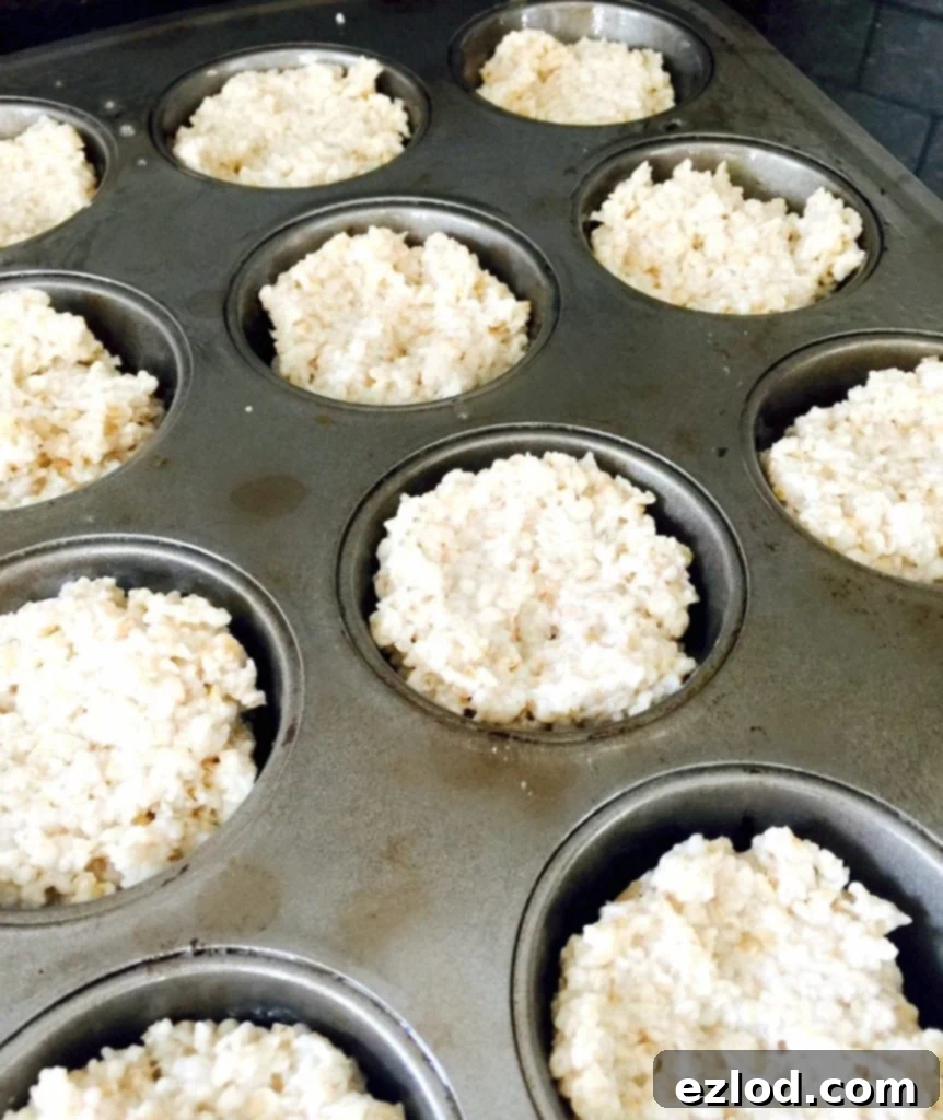 Portioning steel cut oats into muffin tins