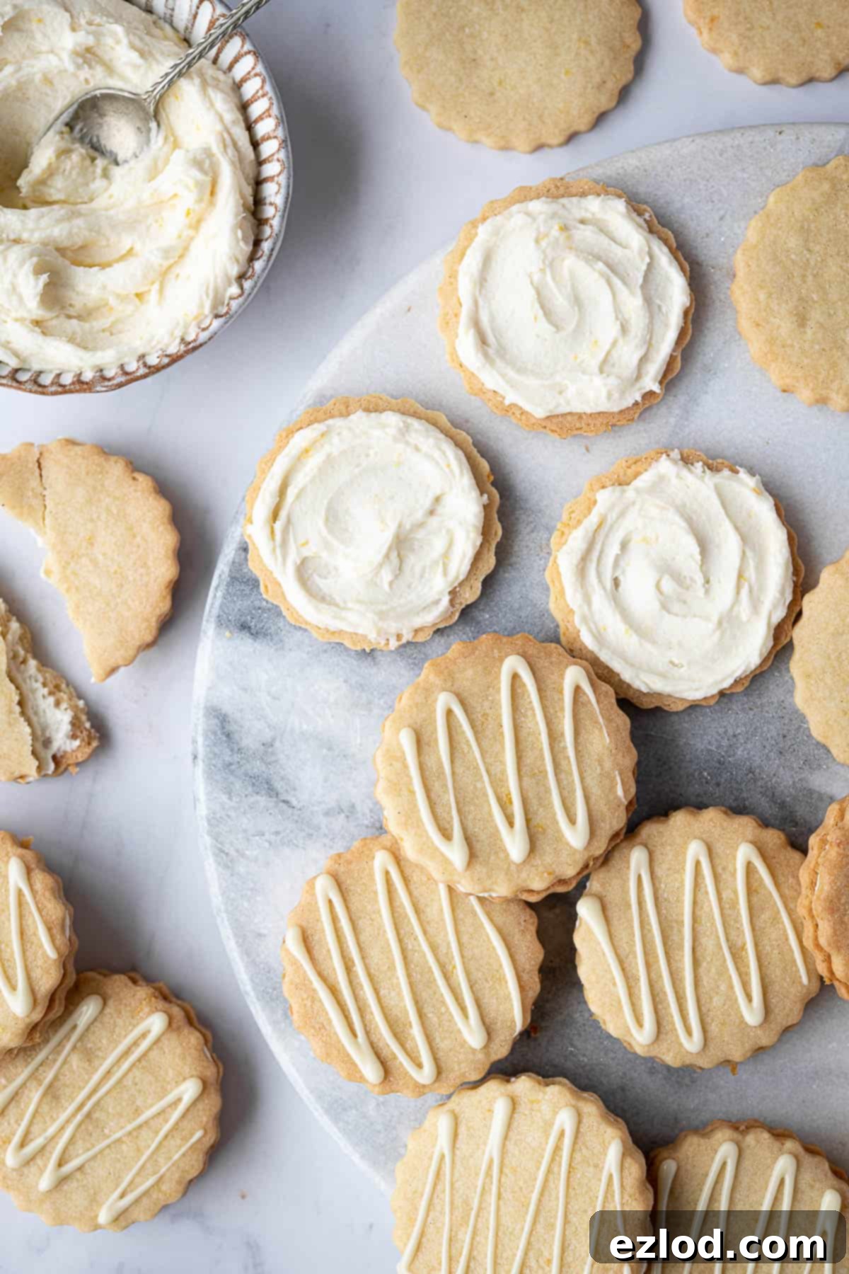 Close up of lemon sandwich cookies spread with buttercream.
