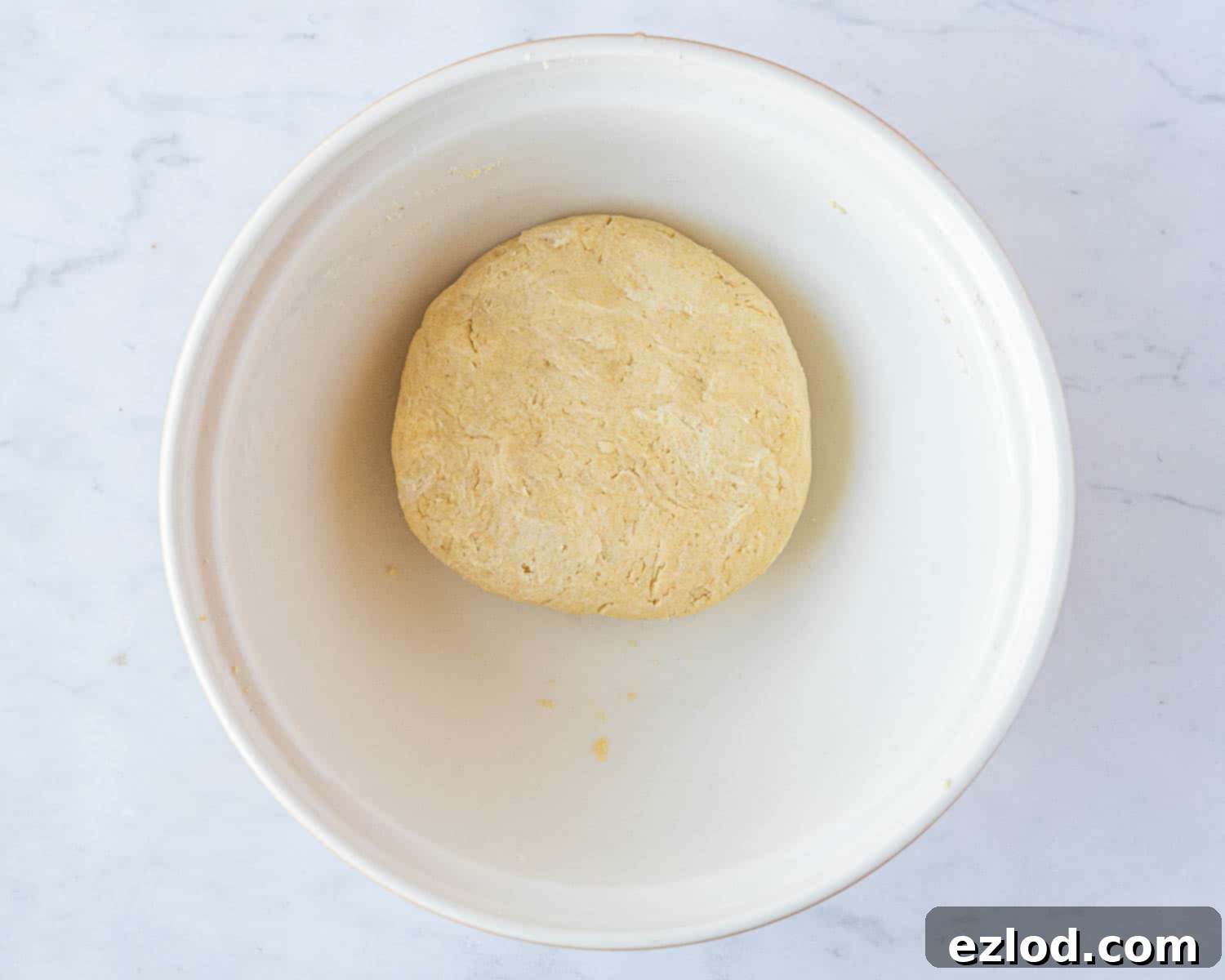 The finished, chilled pastry dough, shaped into a ball and ready to be rolled out for the galette.