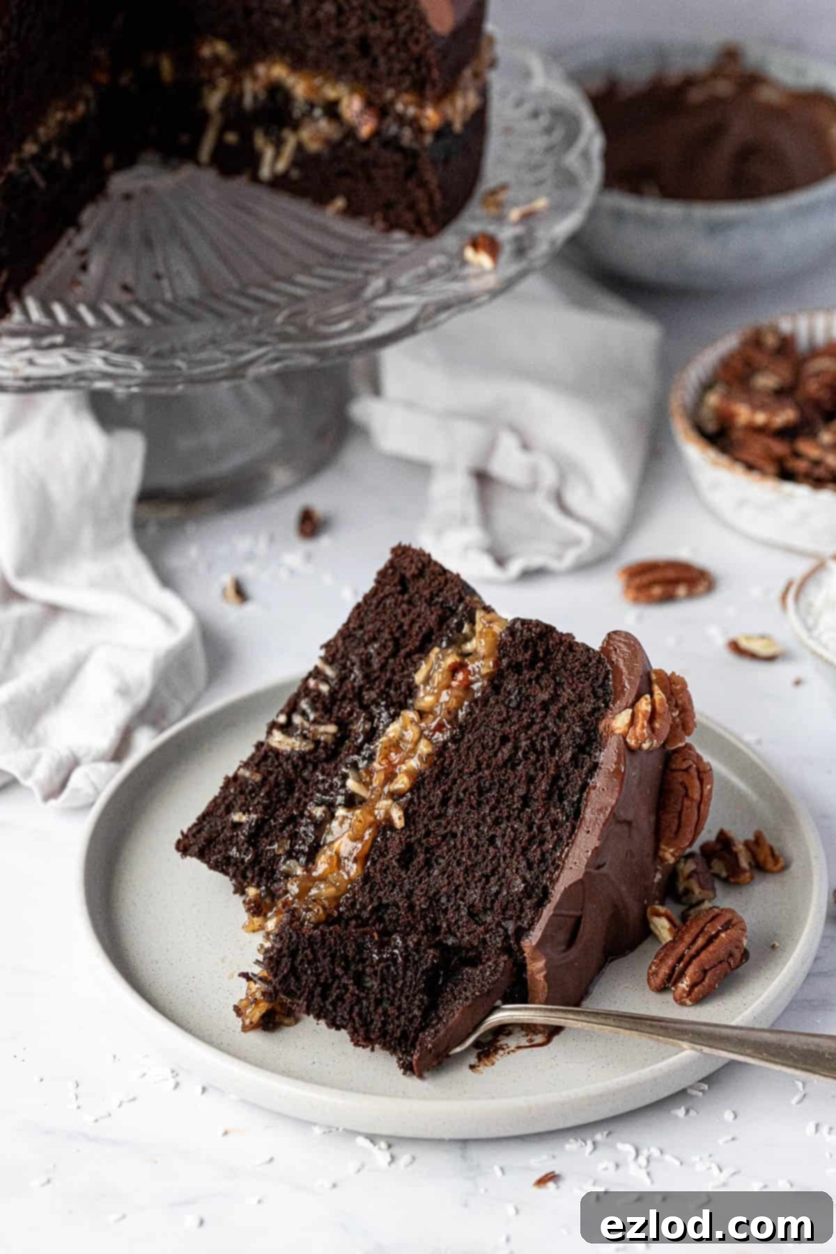 A slice of German chocolate cake on a plate.