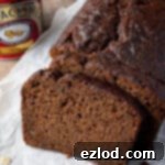 Close up of a slice of ginger loaf cake.