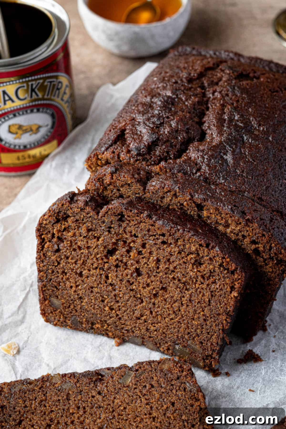 Close  up of a slice of ginger loaf cake.