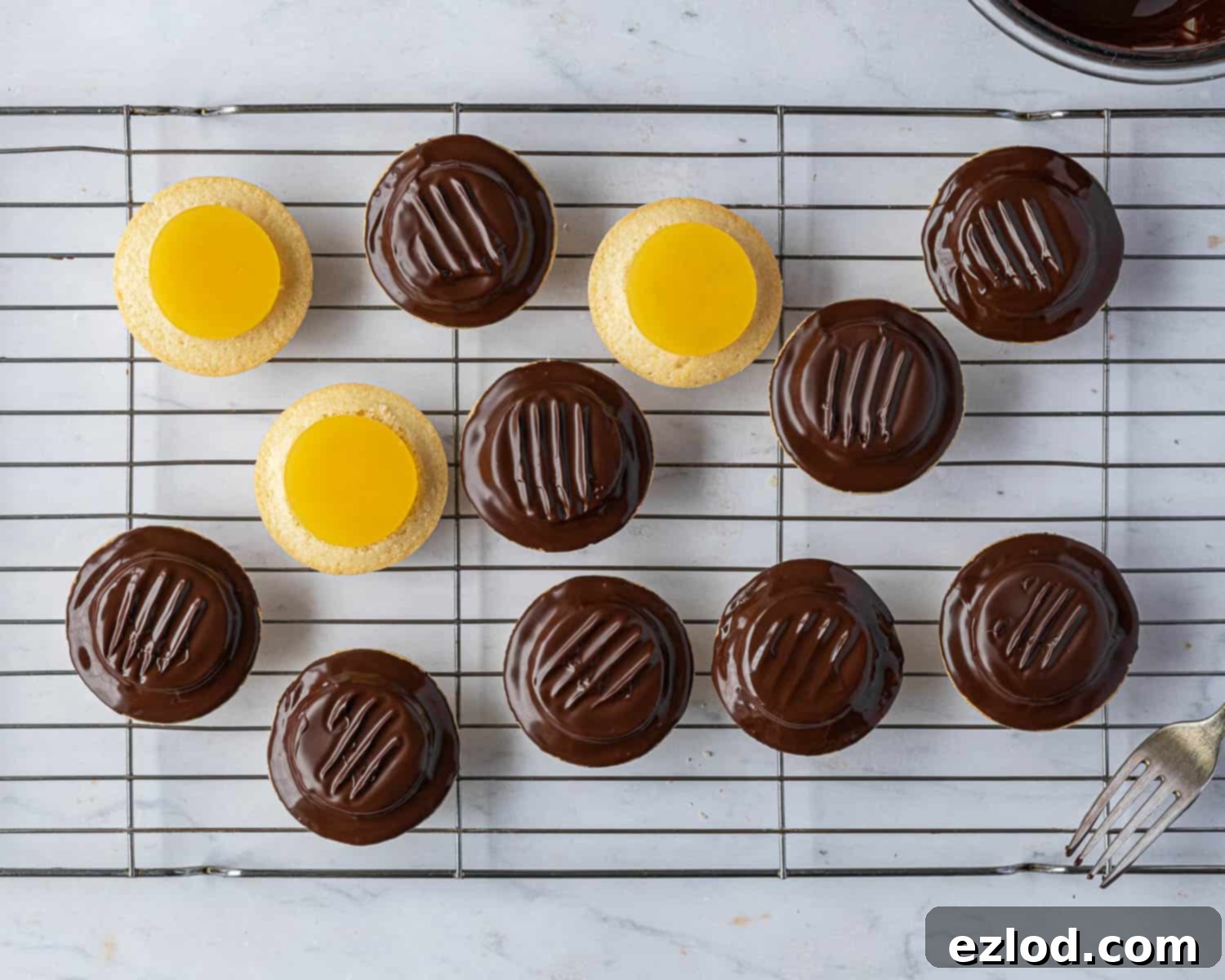 Step 7, adding the jelly and chocolate to the cakes.