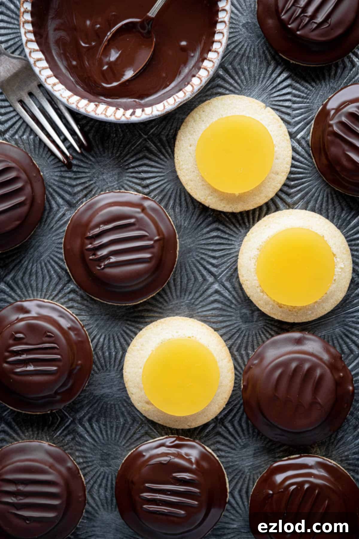 Close up of jaffa cakes, some not yet coated in chocolate.