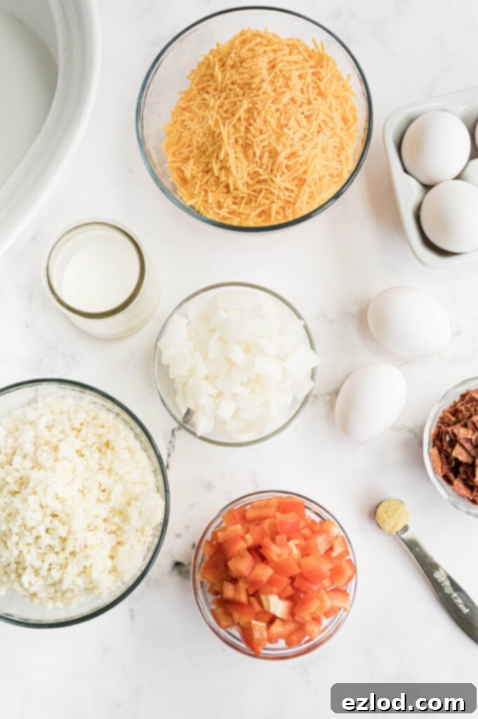 All the fresh ingredients needed for a low carb egg casserole laid out on a white surface