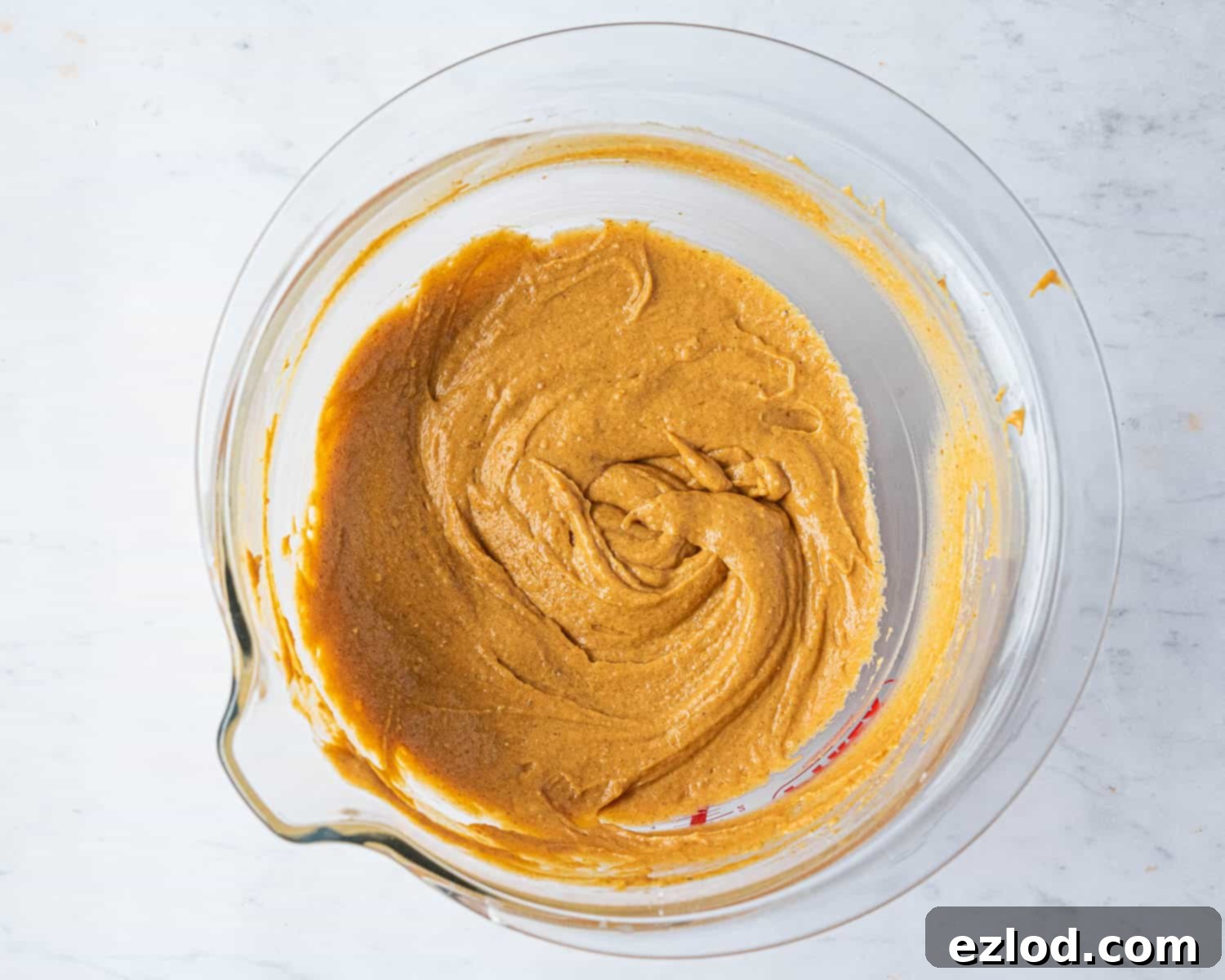 Step-by-step image of the finished cake batter in a bowl, smooth and ready for assembly.