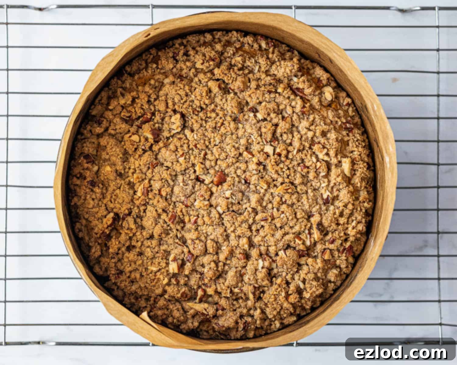 Step-by-step image of the fully baked vegan pumpkin coffee cake, golden brown with crisp streusel.