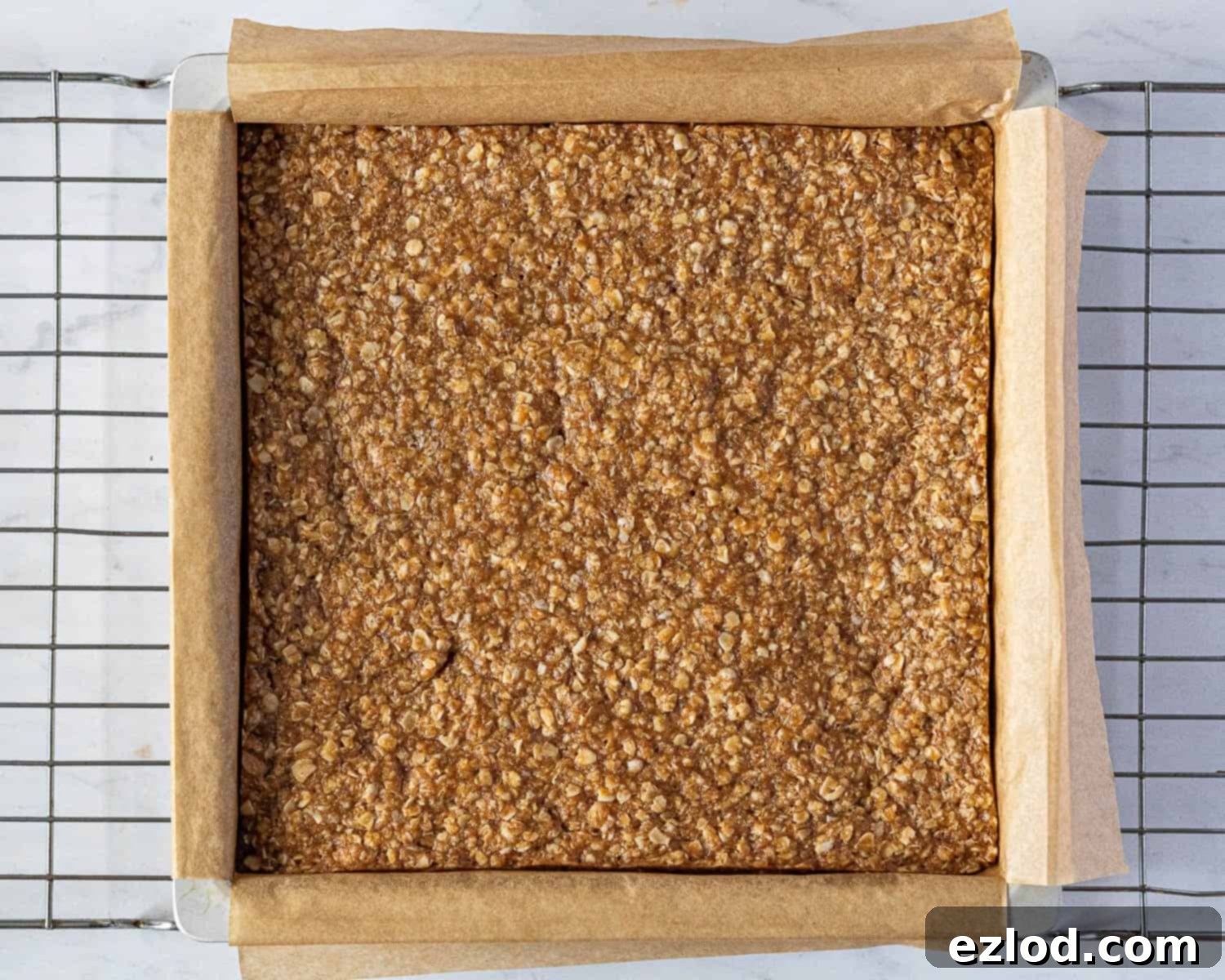 Step 4: The baked flapjacks in the tin, golden and set, fresh out of the oven.