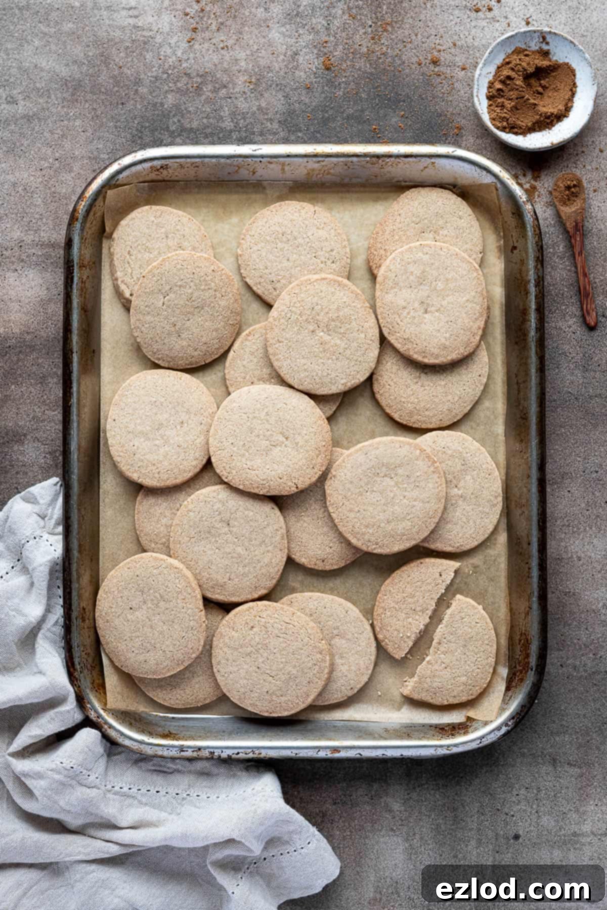 Autumn Plant Based Pumpkin Spice Shortbread 11 Vegan pumpkin spice shortbread on a baking tray, perfectly baked and ready to be enjoyed.