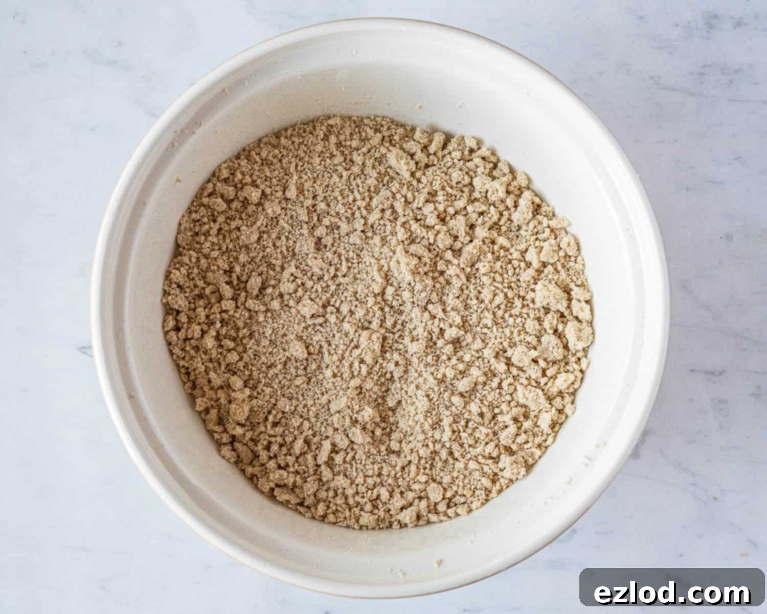 Step 2: Cold, diced vegan butter rubbed into the dry ingredients until the mixture resembles fine breadcrumbs.