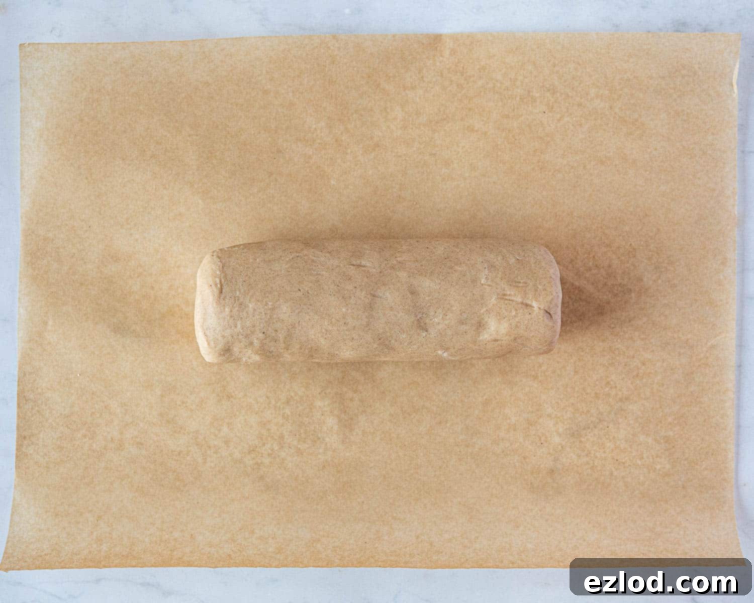 Step 4: The shortbread dough has been shaped and rolled into a thick, even log.