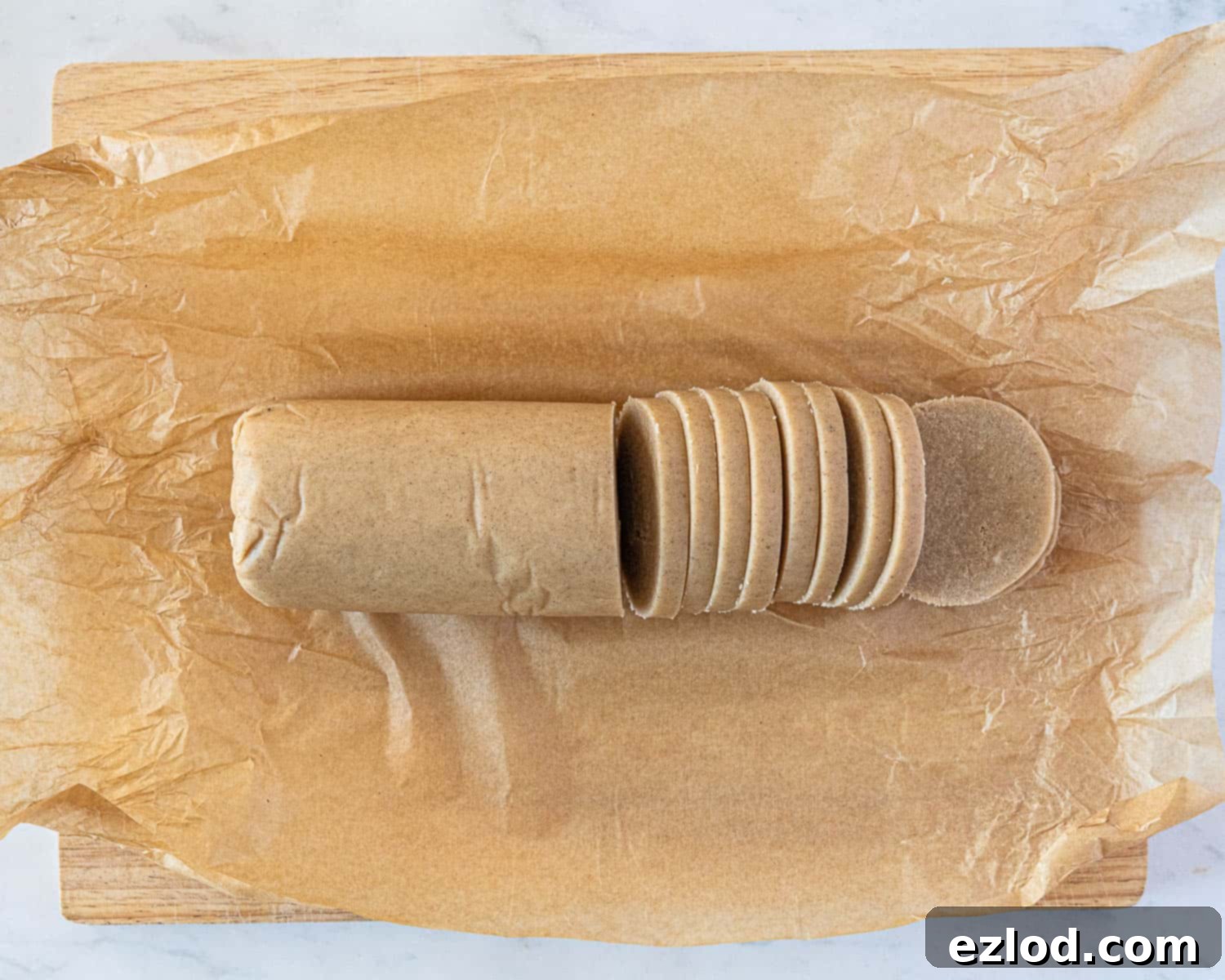 Step 6: The chilled dough log has been sliced into uniform round shortbread cookies.