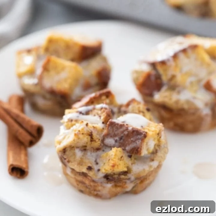 Delicious cinnamon roll french toast casserole cups with a dusting of powdered sugar.