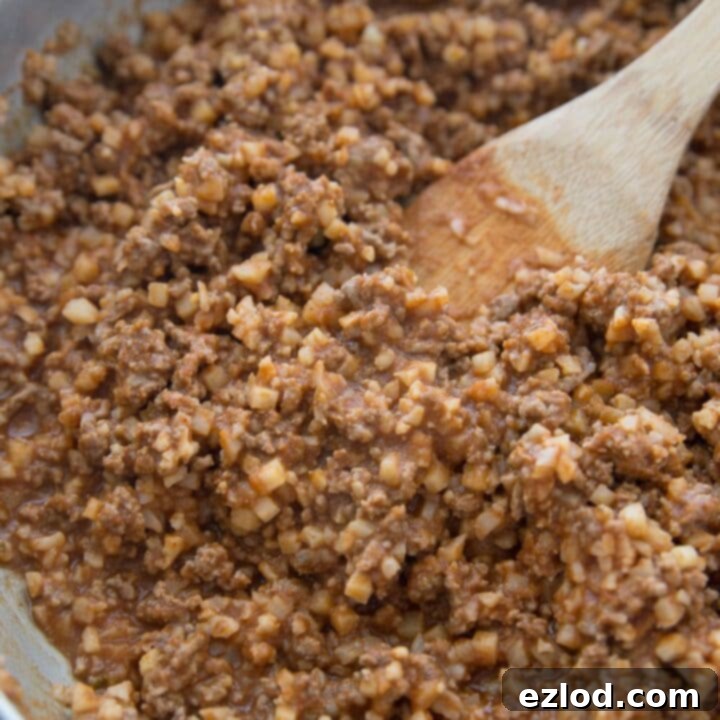 Delicious hidden cauliflower taco meat served in a bowl with fresh toppings.