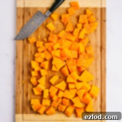 A perfectly cooked and cubed butternut squash, ready for use in various recipes, highlighted as part of the Instant Pot hack.