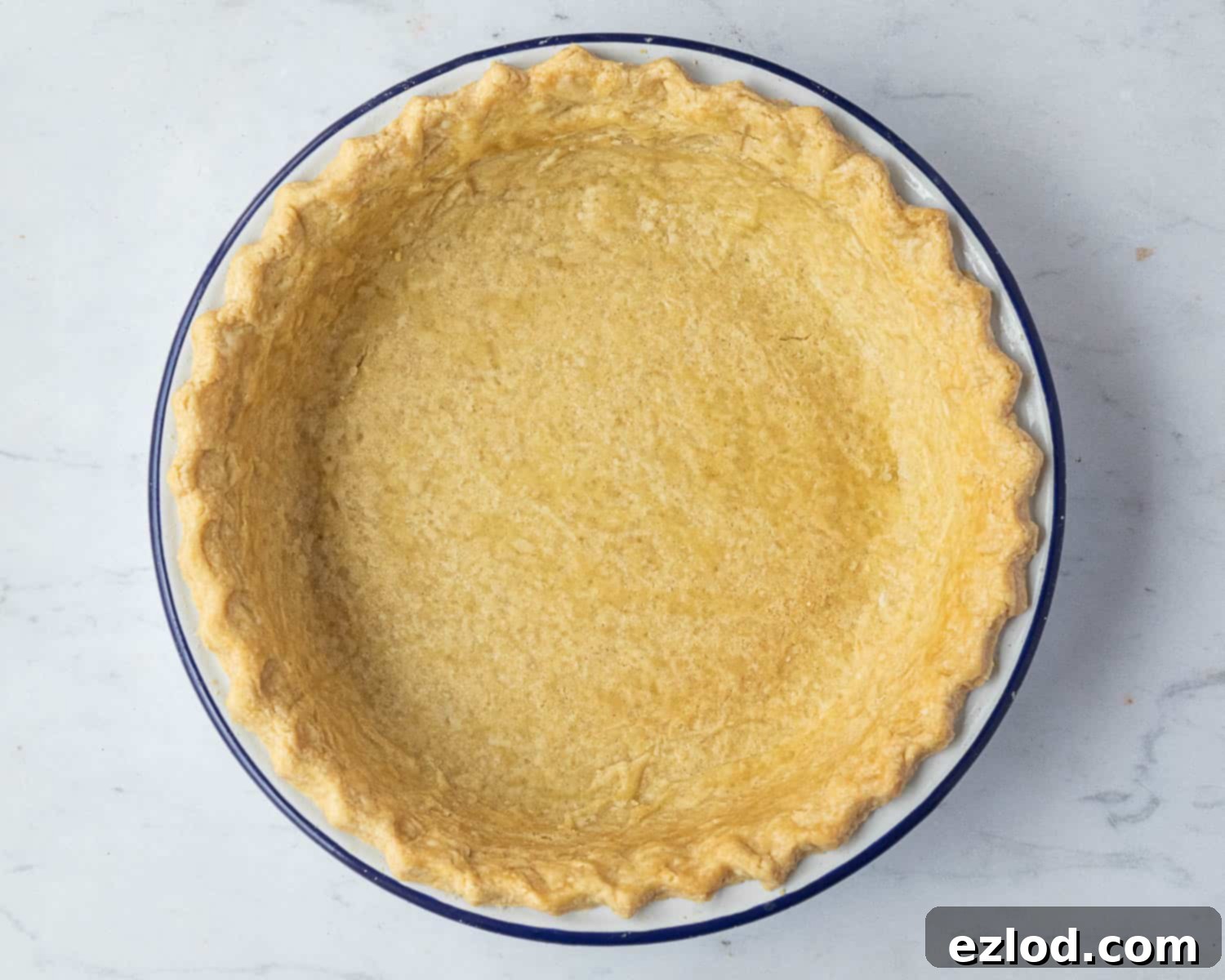 Step 4: The beautifully blind-baked pie shell, golden and crisp, ready to receive its rich chocolate filling.