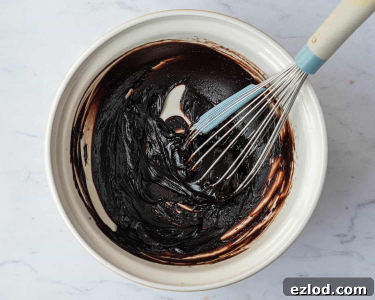 Step 6: The rich, smooth mixture of melted vegan butter and cocoa powder, forming the base for the chocolate filling.