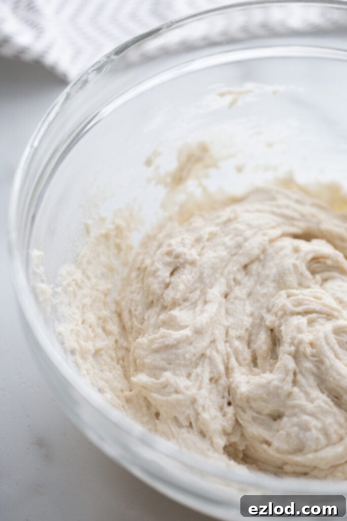 Gluten free dumpling batter in a glass bowl.