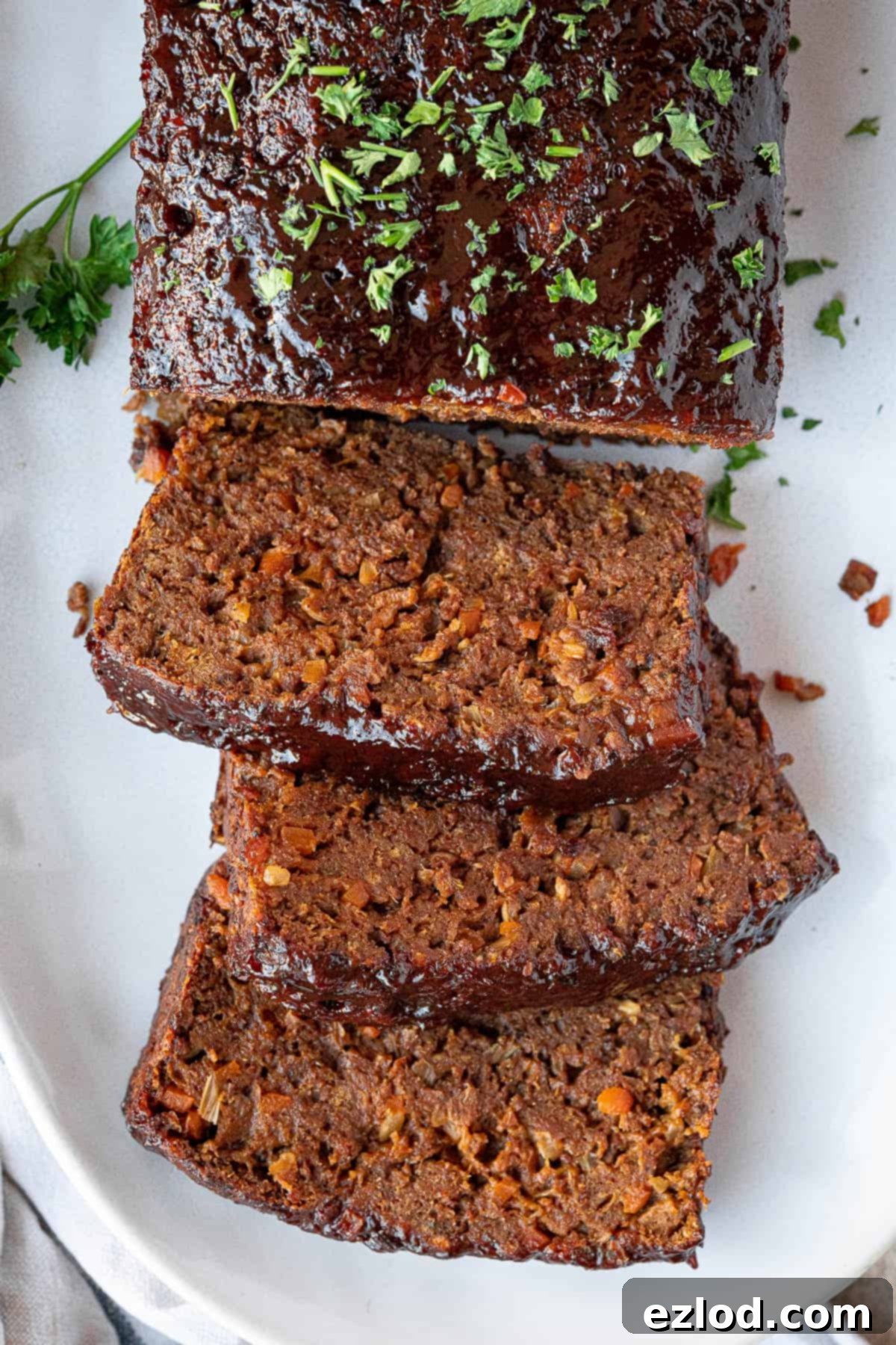 Close-up view of perfectly sliced vegan seitan meatloaf, showcasing its appealing texture.