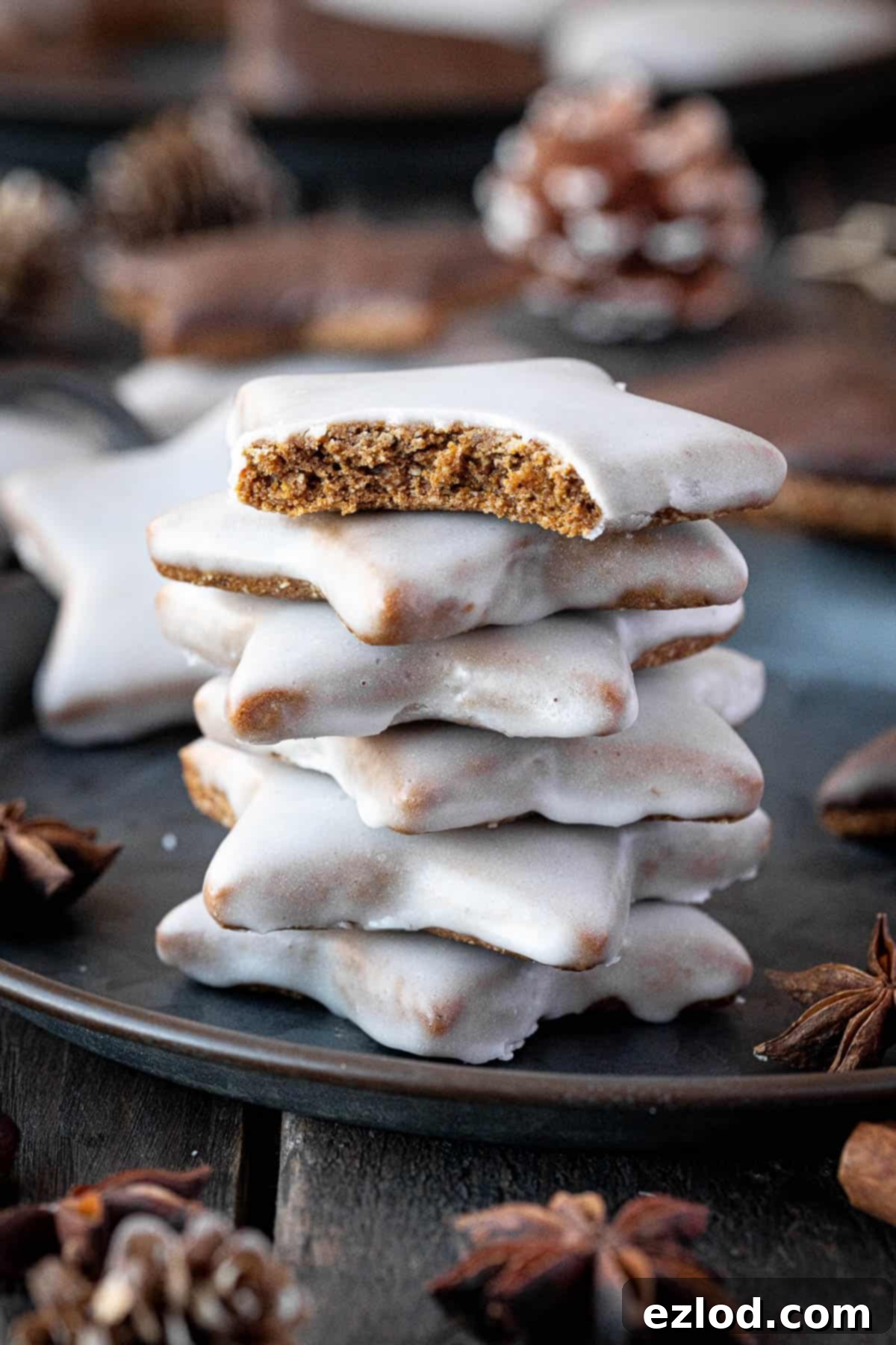 Close up of a stack of vegan lebkuchen stars, beautifully decorated.