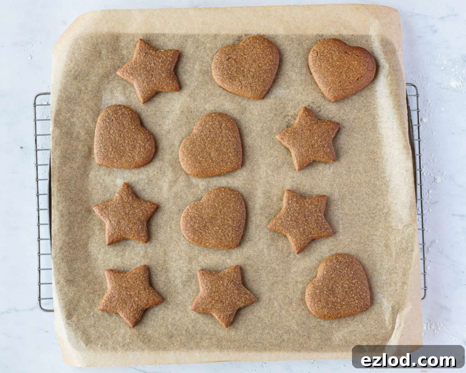 Step 6: Freshly baked vegan Lebkuchen cookies on a baking sheet, lightly browned and ready to cool.