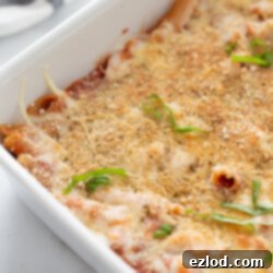Close-up of Chicken Parmesan Pasta, showcasing its rich texture and melted cheese.