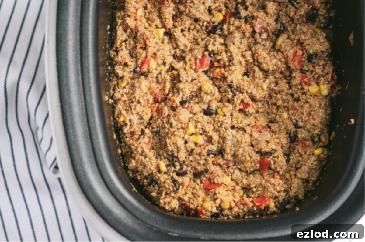 Overhead photo of crock pot taco casserole made with ground turkey, quinoa, diced tomatoes, corn, and black beans.