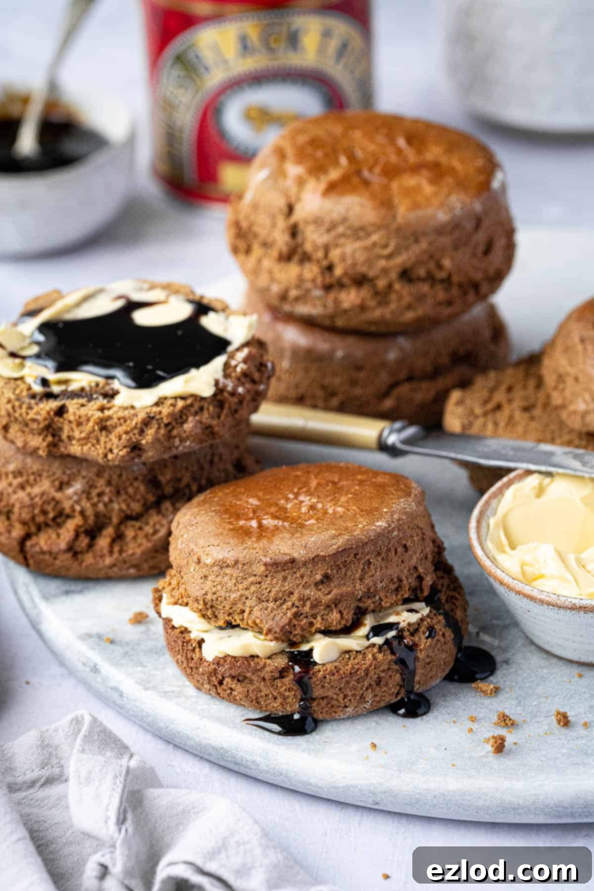 Vegan treacle scoones, some spread with butter and treacle.