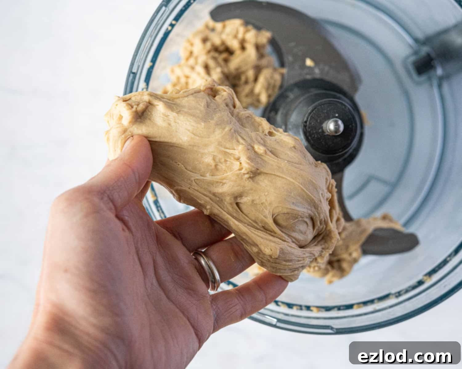 Step 3, showing the stretchy texture of the dough.