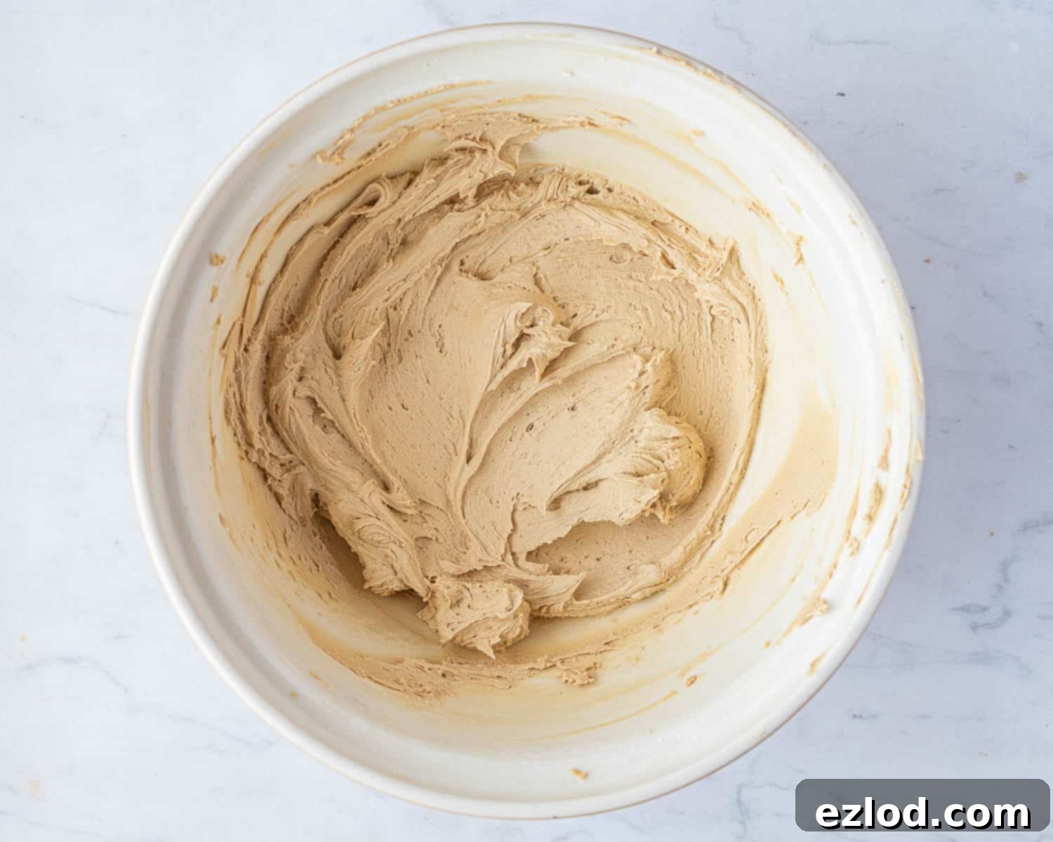 Step 8: The finished coffee buttercream, perfectly whipped to a light and fluffy consistency, ready for frosting.