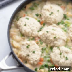 Healthy Chicken Pot Pie in a skillet with biscuit topping.
