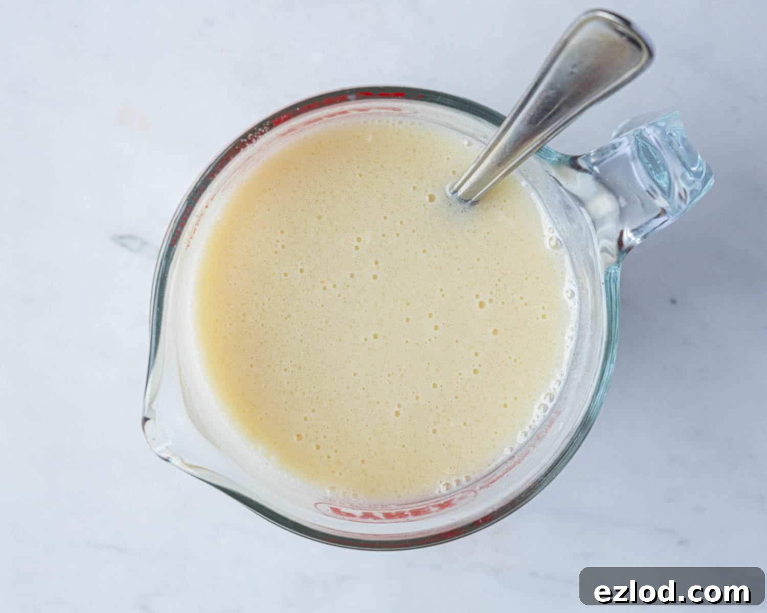 Step 2: Wet ingredients (milk, yogurt, oil, sugar, vinegar, vanilla) whisked together in a jug.