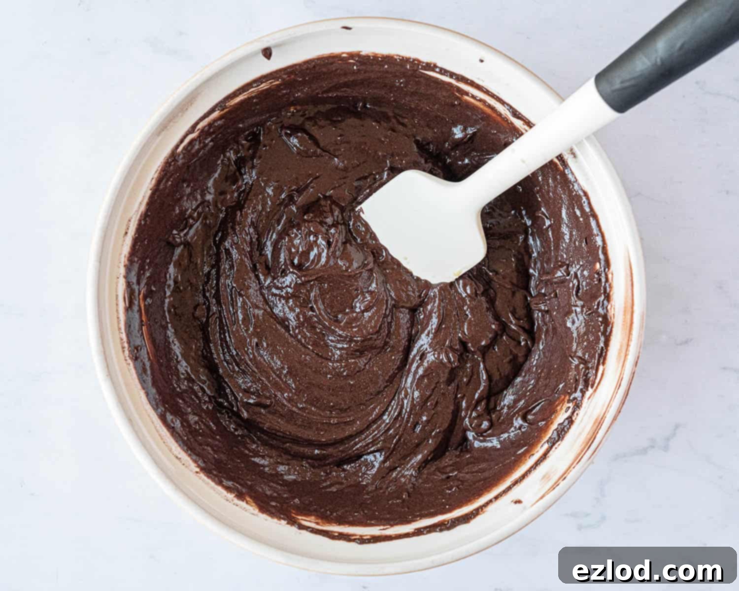 Step 3 in making vegan double chocolate muffins: the muffin batter after wet and dry ingredients are combined.