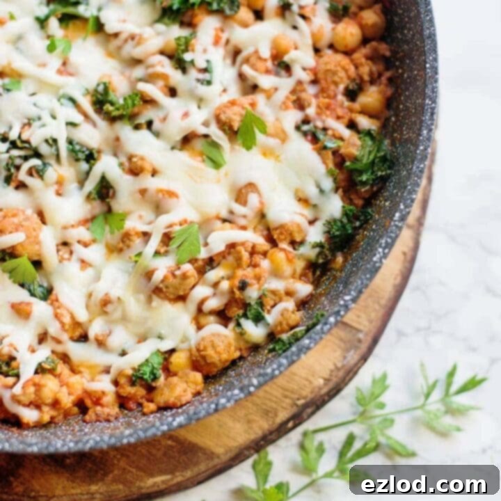 Healthy Sausage, Bean, and Kale Skillet in a pan.
