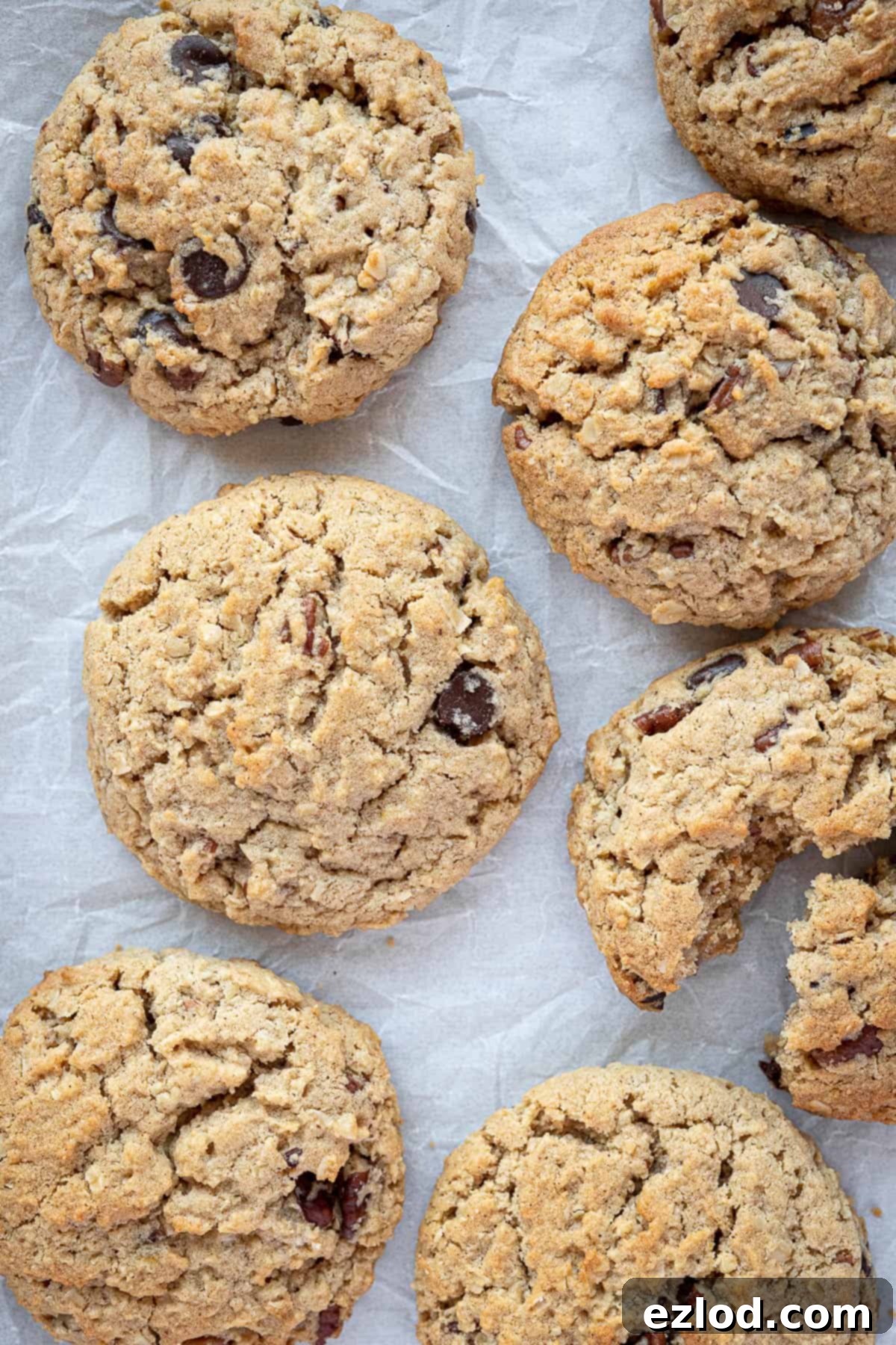 Close-up of baked vegan peanut butter oatmeal cookies, cooling down, showing their inviting texture.