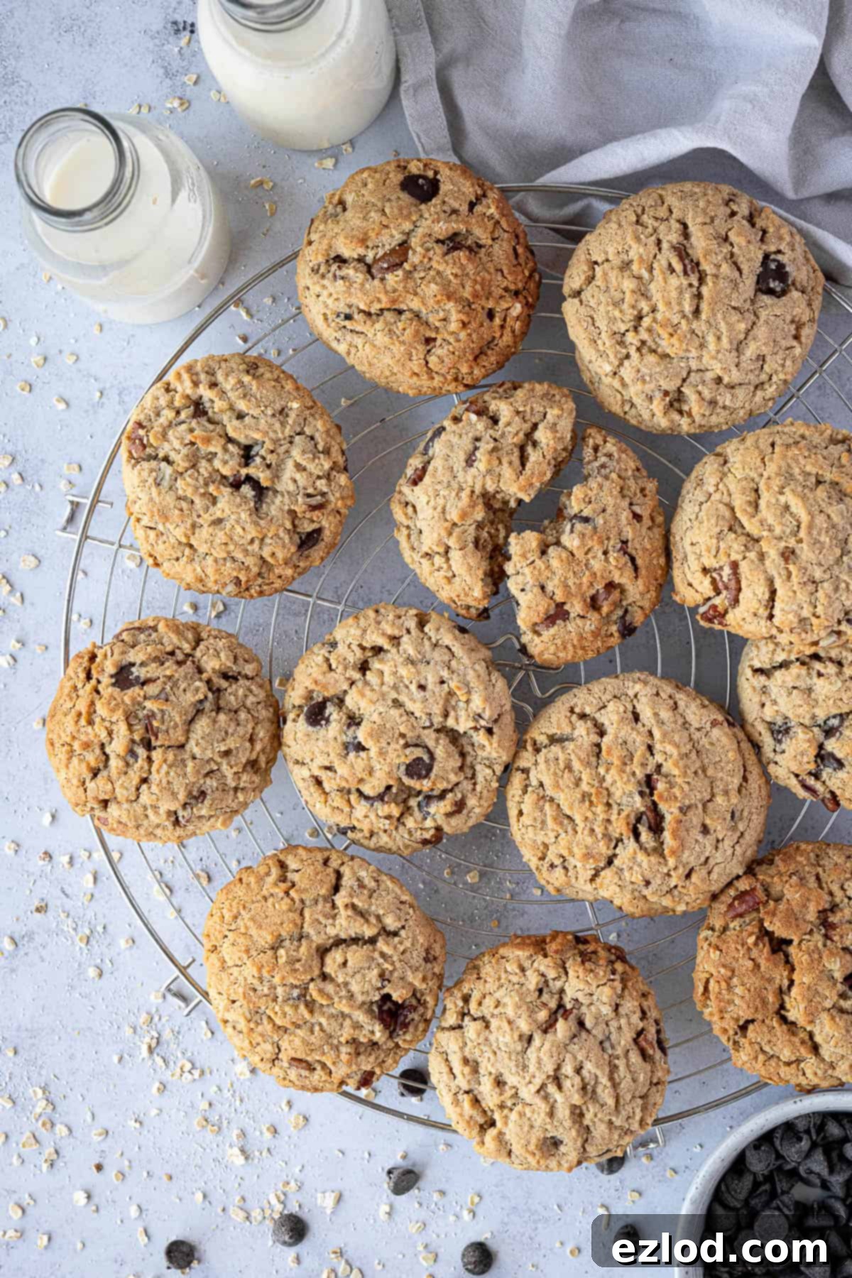 Freshly baked vegan peanut butter oatmeal cookies cooling on a round wire rack, ready to be enjoyed.
