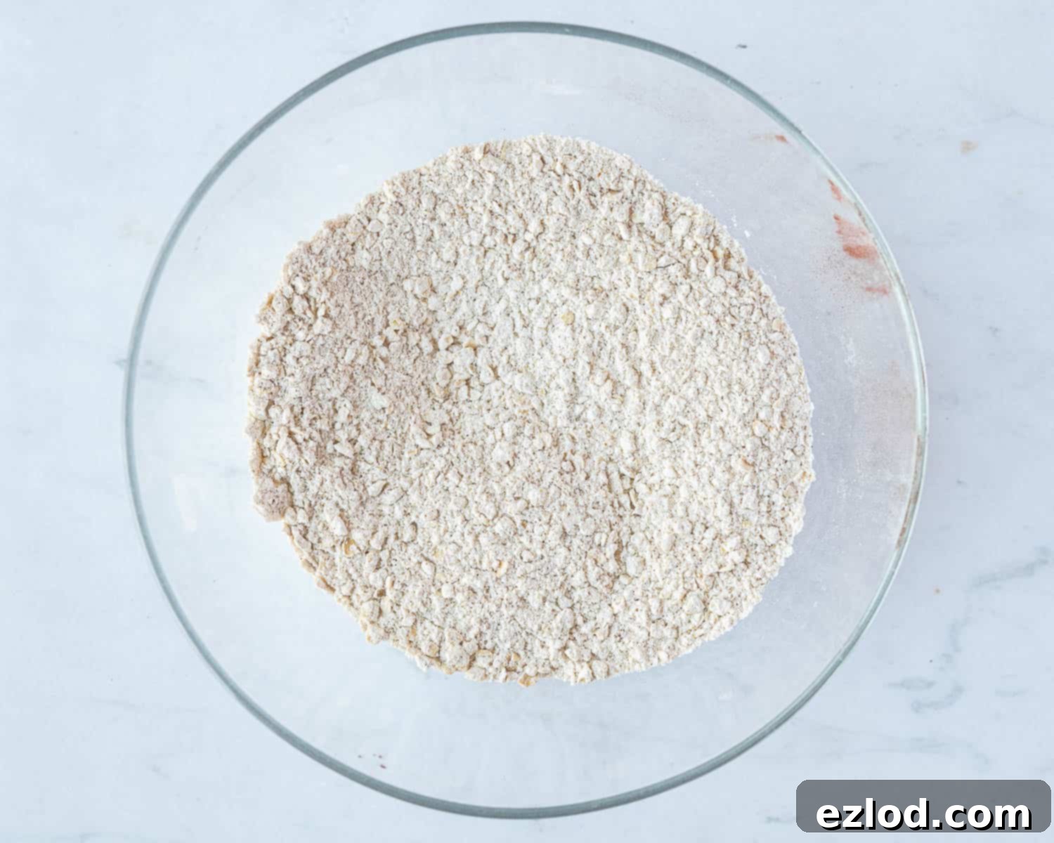 Step 2: A bowl containing the dry ingredients – flour, oats, leavening agents, and spices – well mixed.