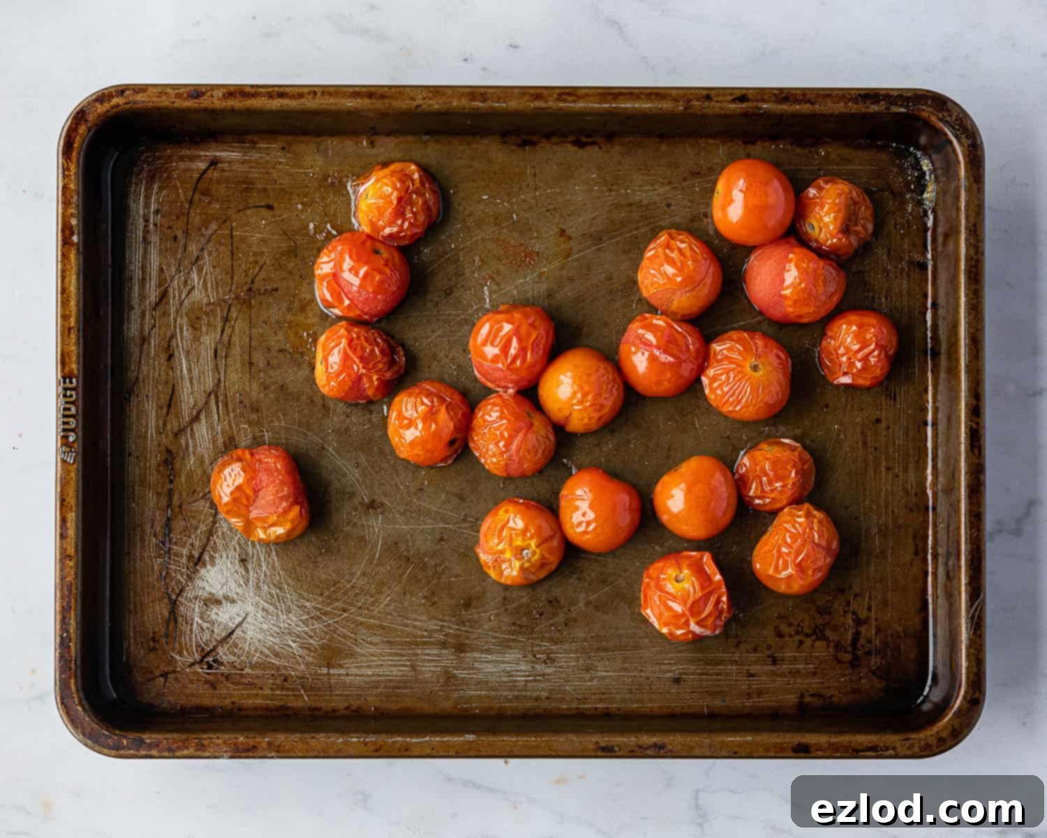 Step 5: Ripe cherry tomatoes, roasted to perfection, adding depth of flavor to the quiche.