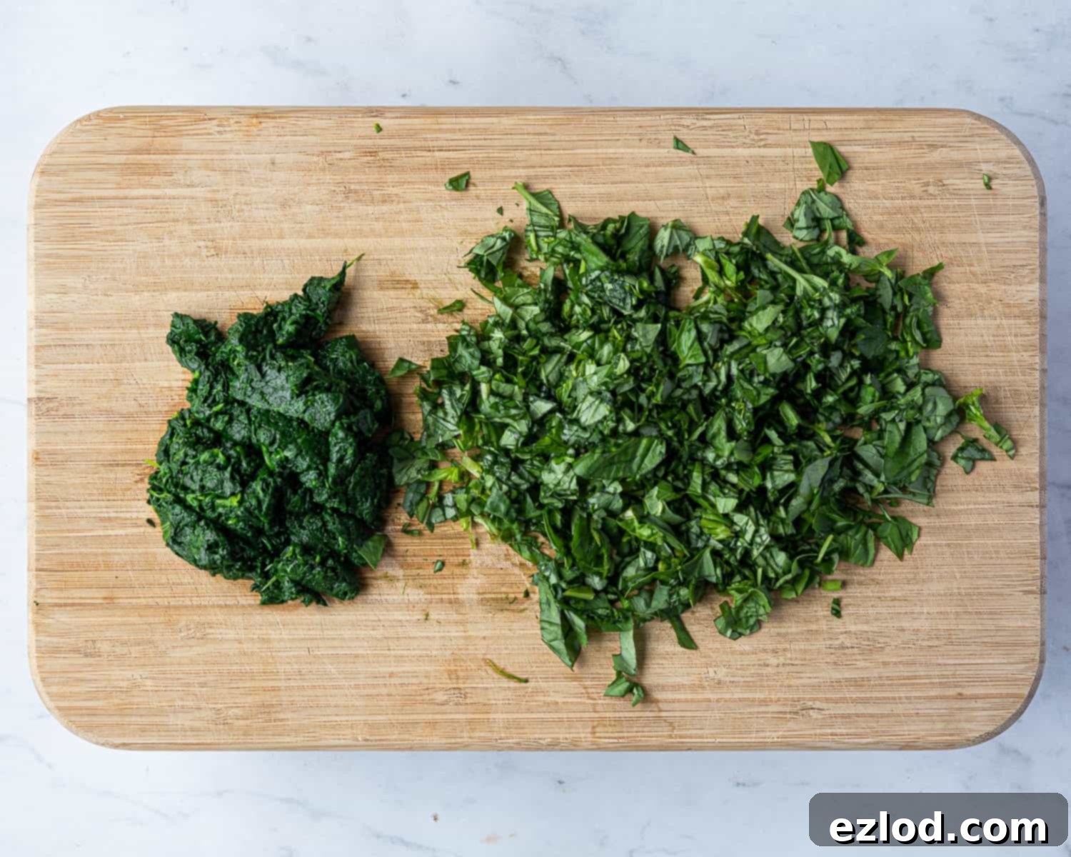 Step 7: Finely chopped spinach and fresh basil, prepared to be incorporated into the creamy quiche filling.