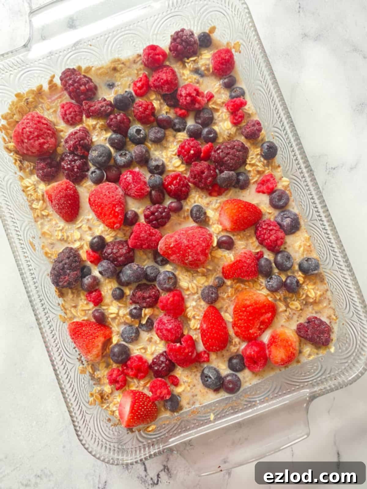 The one-pan baked oatmeal, golden and bubbling with berries, freshly removed from the oven and perfectly set. 